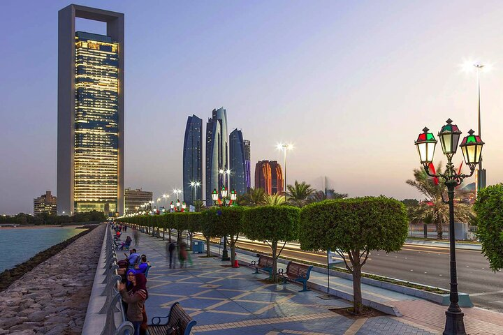 Discover the stunning skyline of Abu Dhabi where modern architecture meets serene waterfront views perfect for exploring cultural landmarks and enjoying leisure along the promenade.